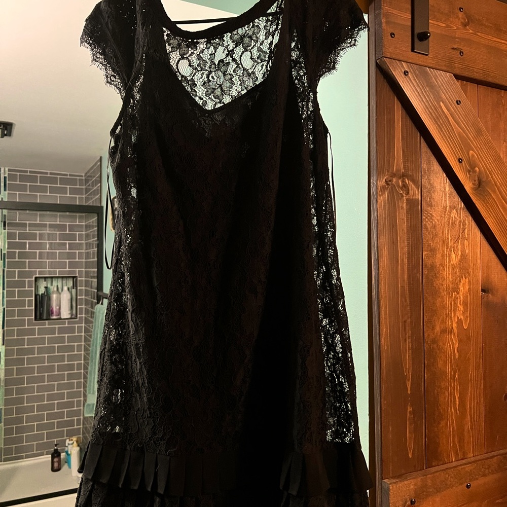 Jessica Simpson lace black cocktail dress with pleated bottom.   Size 12!